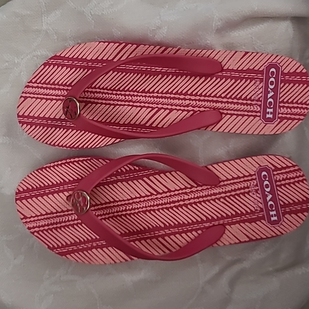 Coach pink flip flops size L 7-8